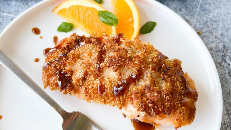 Salmon crusted with nutty quinoa and drizzled with a simple...