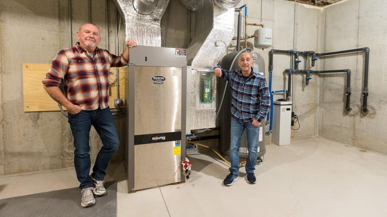 Daniel Gontcharenko, left, and partner John Daidone installed a geothermal system...