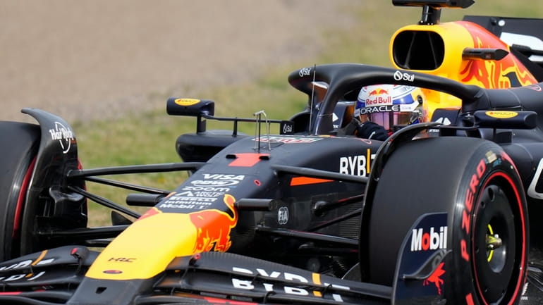Red Bull driver Max Verstappen of the Netherlands steers his...