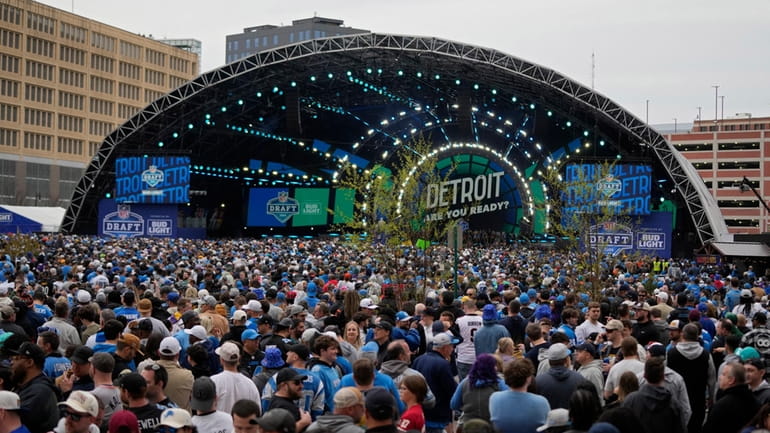 Crowds fill an area outside of the draft stage during...