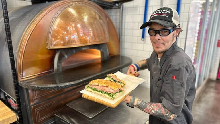 Pizzaiolo Auggie Russo also makes sandwiches on his focaccia at...