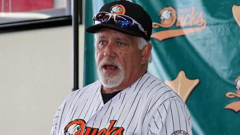 Long Island Ducks manager Wally Backman speaks with reporters during media...