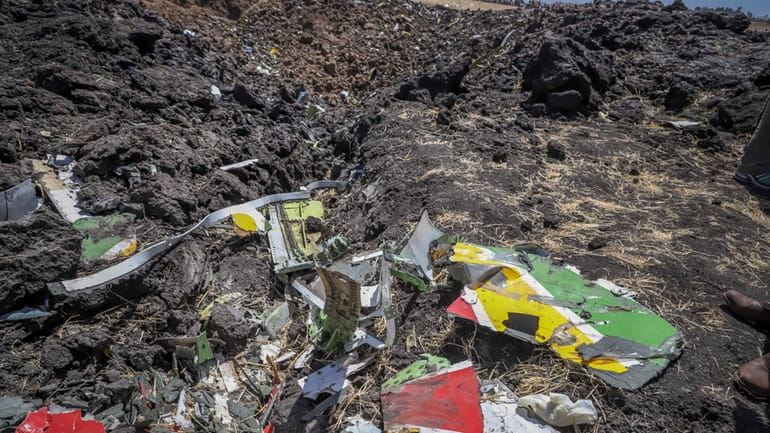 Wreckage lies at the scene of an Ethiopian Airlines flight...