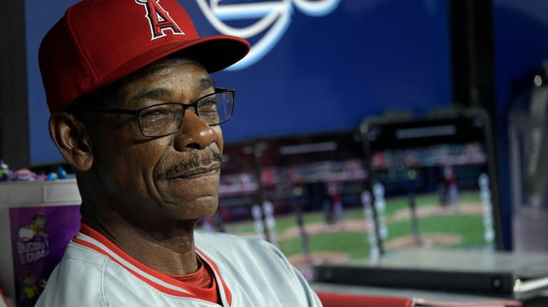 Los Angeles Angels manager Ron Washington sits in the dugout...