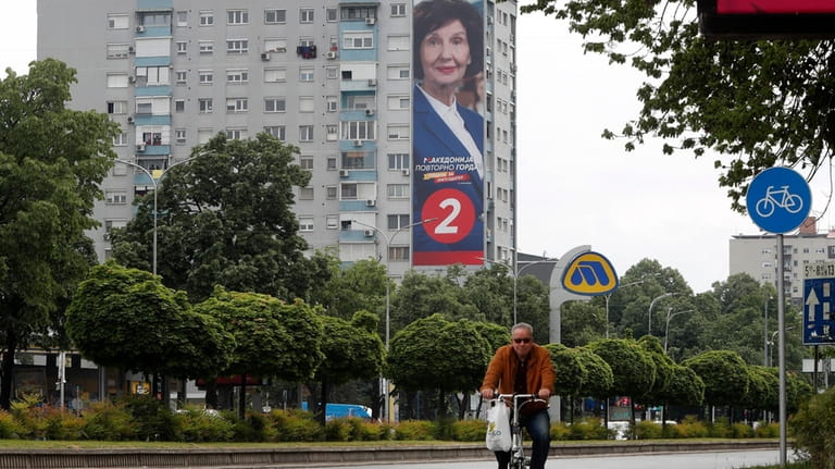 A giant poster of Gordana Siljanovska Davkova, a presidential candidate...