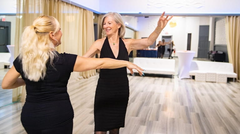 KL Dance instructor Lori Ann Roche gives a dance lesson...