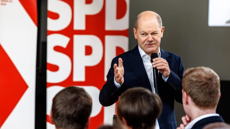 German Chancellor Olaf Scholz speaks at a Citizens' Dialogue organized...