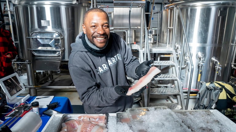 Jermaine Owens with cod from North Fork Seafood at the...