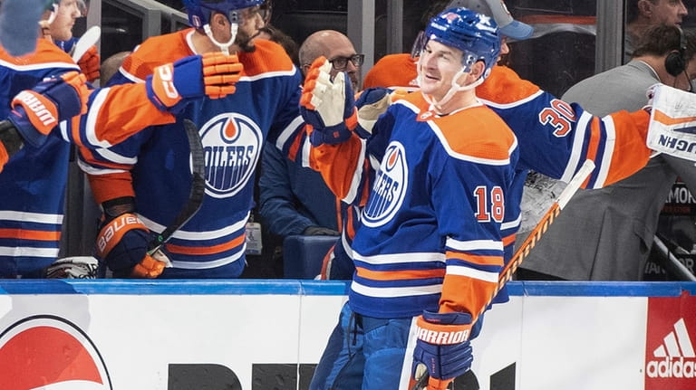 Edmonton Oilers' Zach Hyman (18) celebrates his hat trick against...