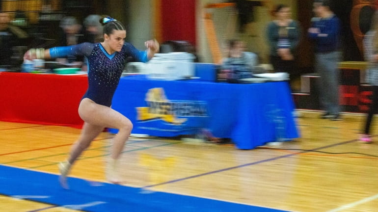 West Babylon’s Lindsey Kutchens had a 9.175 on vault, and...