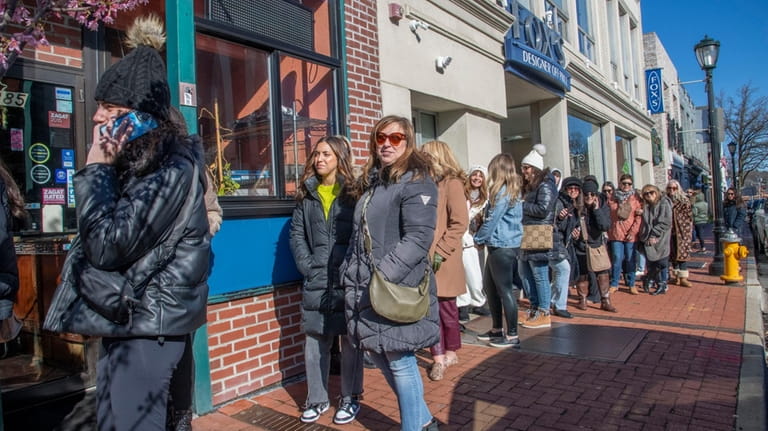A line formed at the opening of Envy in Huntington,...