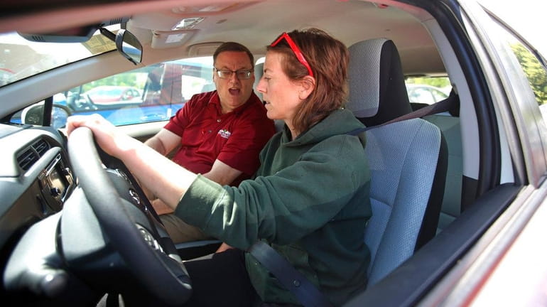 Vehicle shopper Mary Jean Jones takes a test drive in...