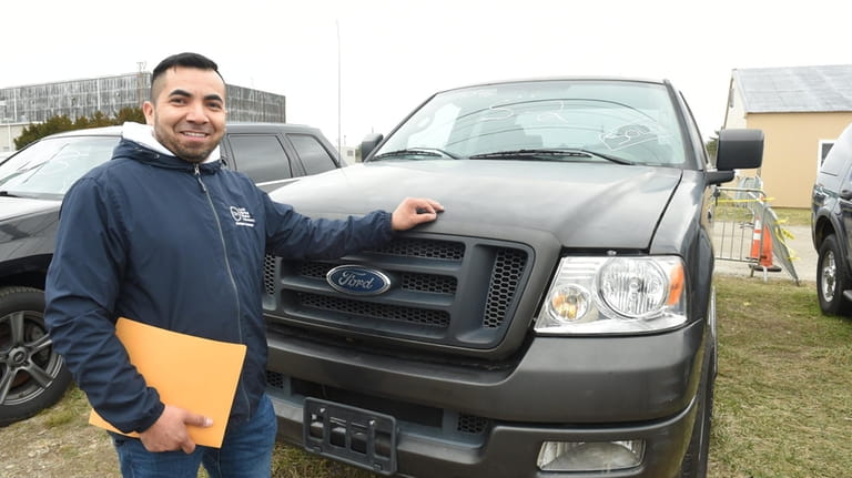 Jose Maradiaga, of Huntington, landed a pickup truck at the...