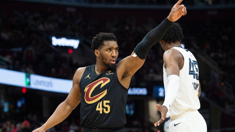 Cleveland Cavaliers' Donovan Mitchell (45) directs his team as Memphis...
