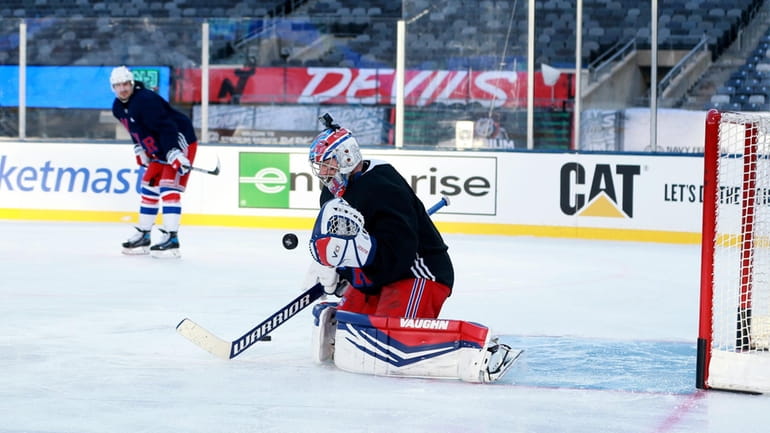 Jonathan Quick works in the goal during Rangers practice at...