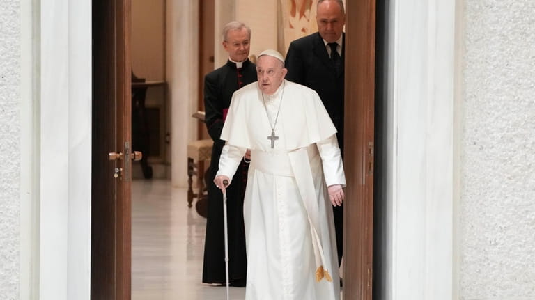 Pope Francis arrives in the Paul VI hall on the...