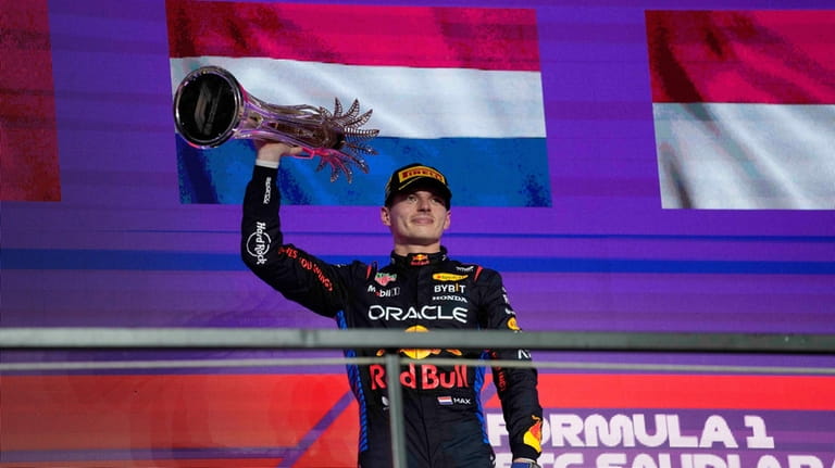 Red Bull driver Max Verstappen of the Netherlands celebrates after...