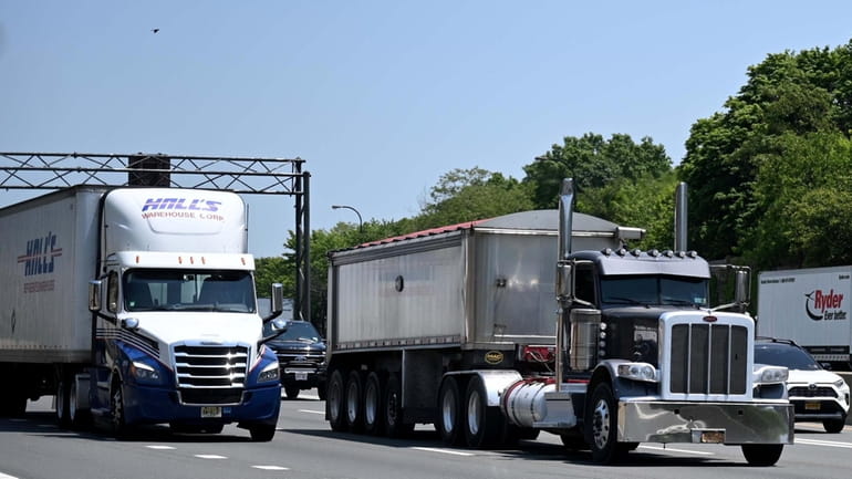 Trucks on the westbound Long Island Expressway near Robbins Lane. MTA...