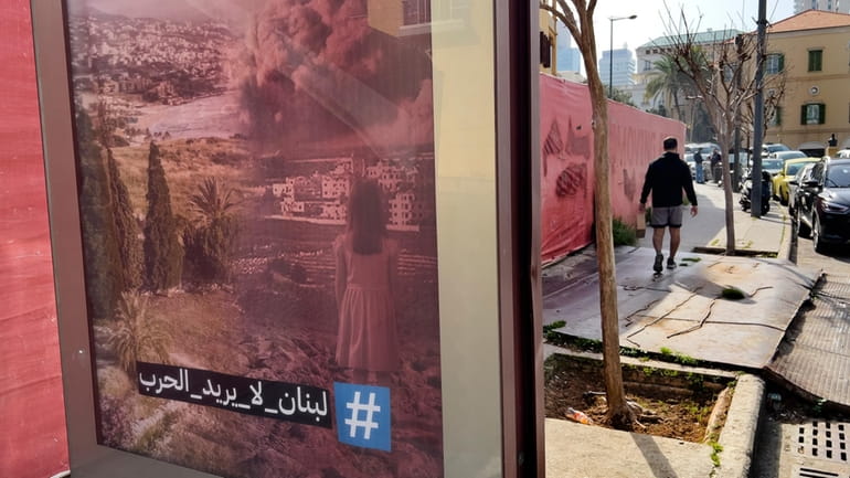 An anti-war advertising poster with Arabic words that read: Lebanon...