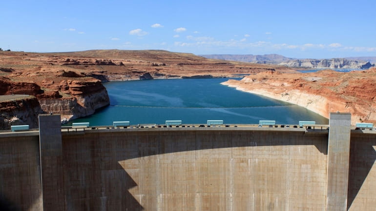 The Glen Canyon Dam is seen, Aug. 21, 2019, in...