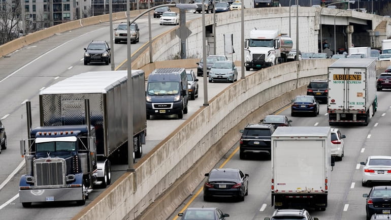 Motor vehicle traffic moves along the Interstate 76 highway in...