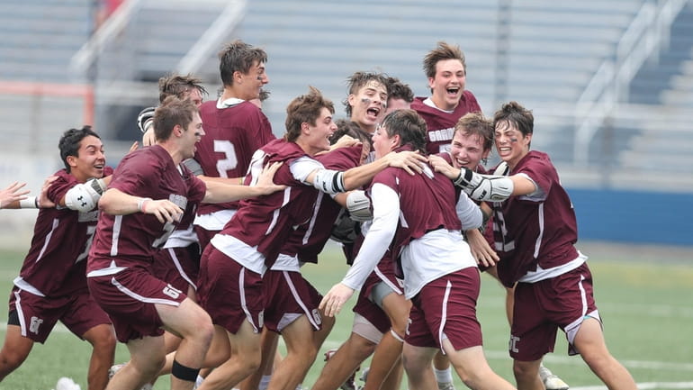 Garden City celebrates their win during New York State High...