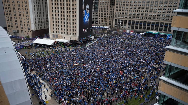 Crowds fill an area outside of the draft stage during...