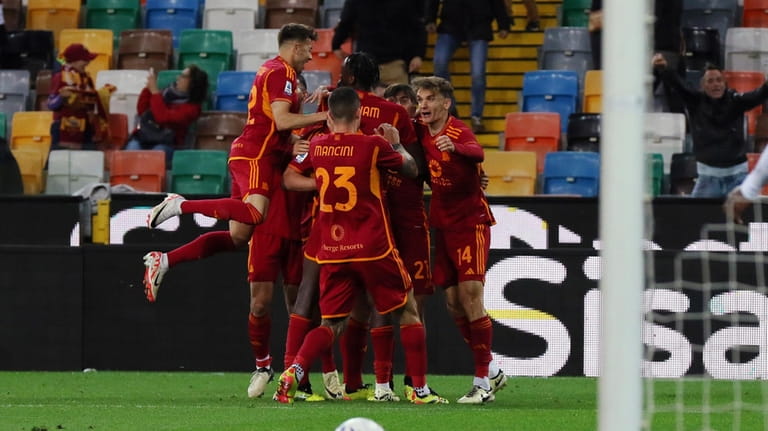 Roma's Bryan Cristante celebrates after scoring their side's second goal...