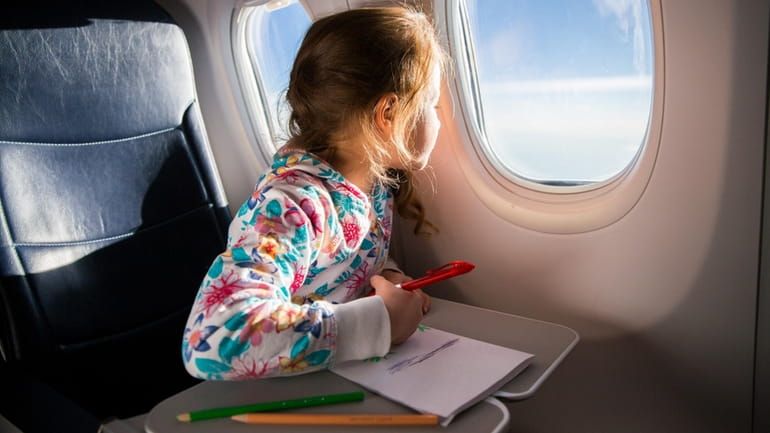 Packing items that'll keep kids engaged in your carry-on bag...