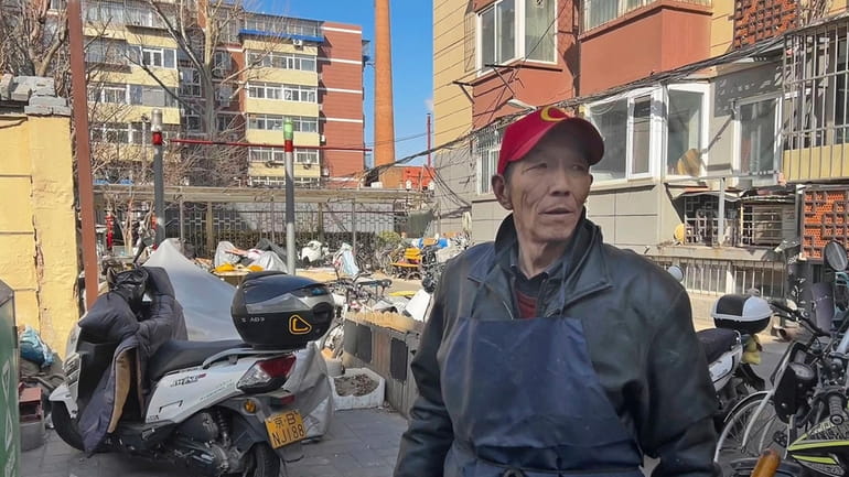 Duan Shuangzhu, 68, a waste collector who moved to Beijing...