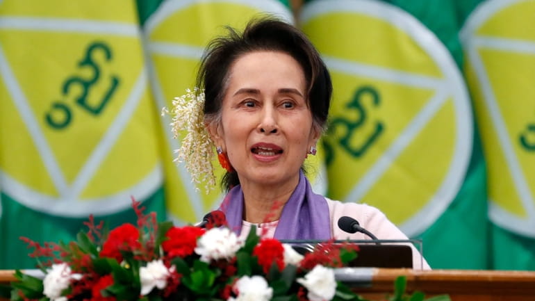 Myanmar's then leader Aung San Suu Kyi delivers a speech...