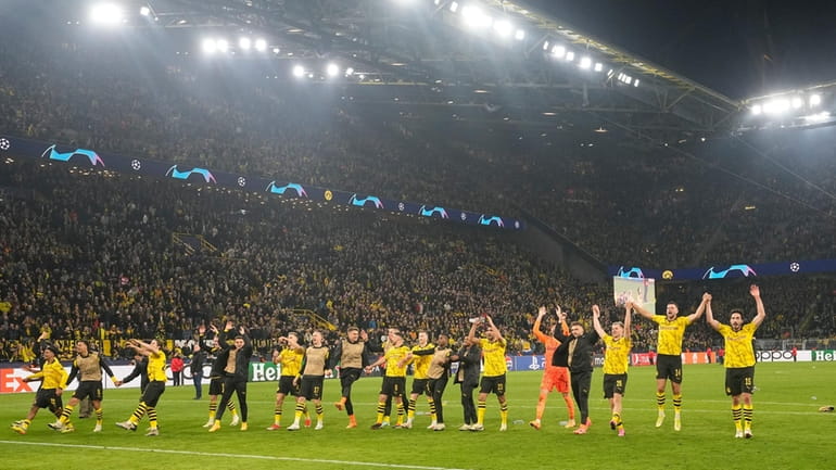 Dortmund's players celebrate with fans after winning the Champions League...