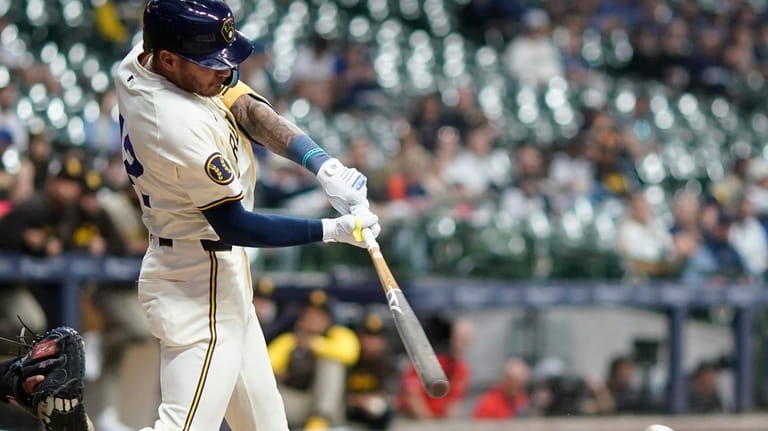 Milwaukee Brewers' Joey Ortiz hits a single during the second...