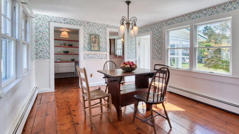 The house has retained its original wide hardwood floorboards and largely...