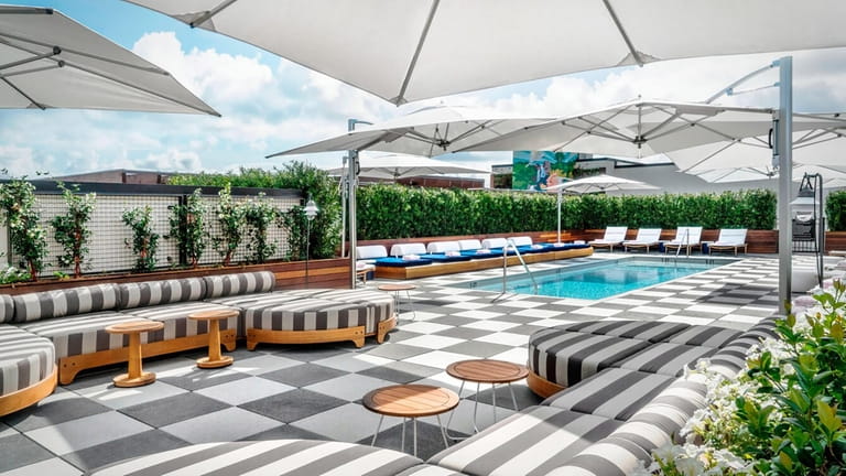 A rooftop pool is among the amenities at the Perry...