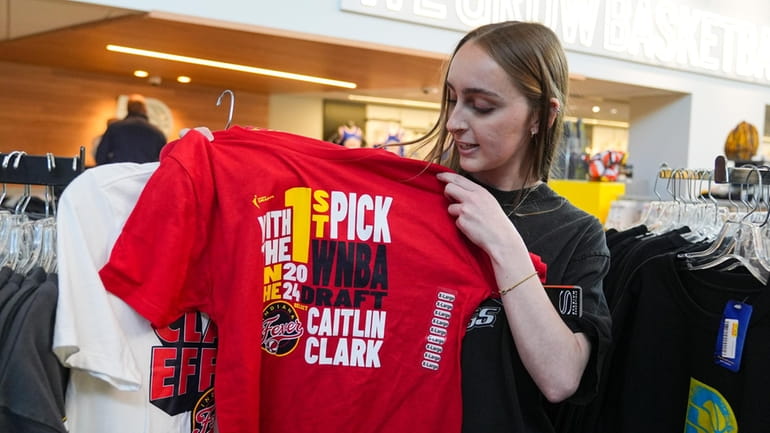 Shelby Tekulve, 20, displays one of the Caitlin Clark shirts...