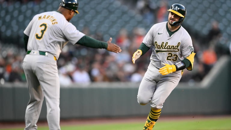 Oakland Athletics' Shea Langeliers (23) celebrates after his home run...