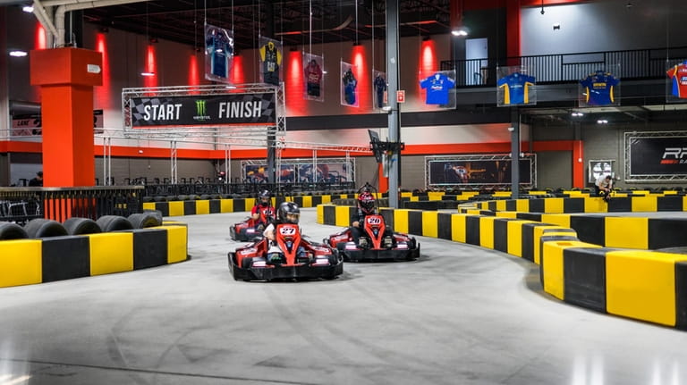 Families can race each other at the indoor go-kart track...