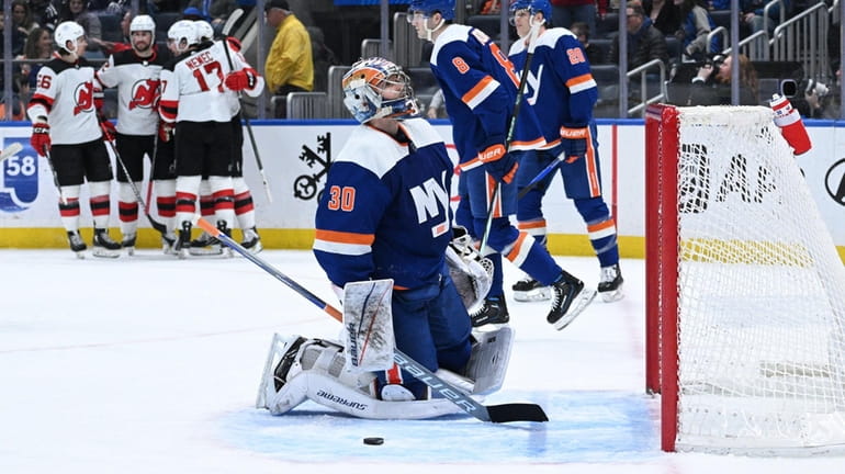 Islanders goaltender Ilya Sorokin reacts as the New Jersey Devils...