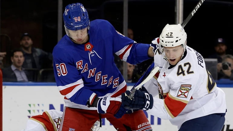 Will Cuylle of the Rangers battles in the front of...