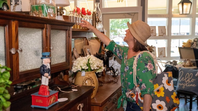 Christine Cimone of Farmingdale browses at Back in Time vintage in...