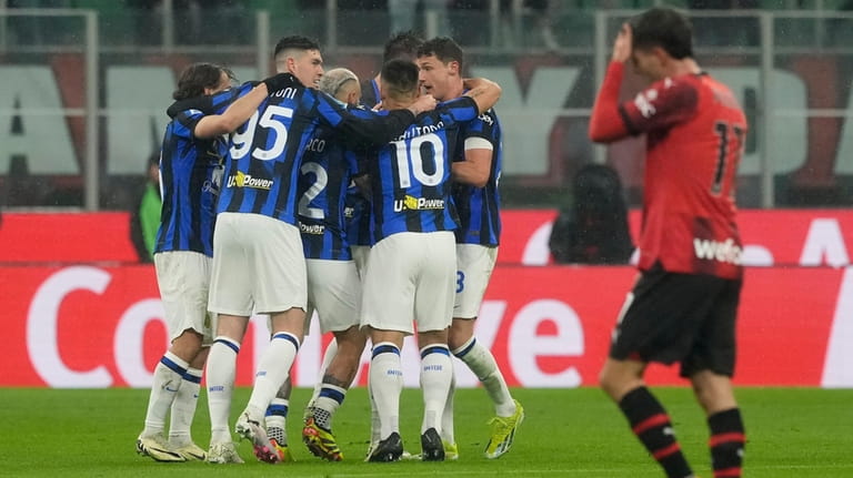 Inter Milan pla'yers celebrate after their teammate Francesco Acerbi scores...