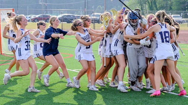 Bayport-Blue Point girls lacrosse celebrates its state championship win on June 10, 2023...