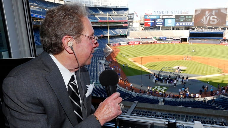 New York Yankees radio broadcaster John Sterling poses for a...