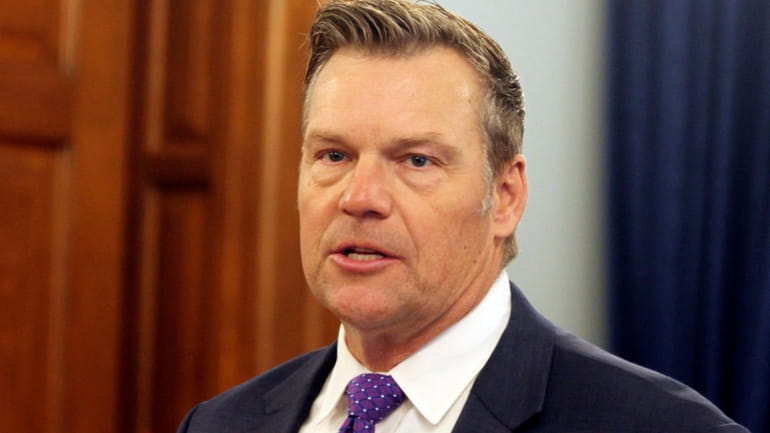 Kansas Attorney General Kris Kobach announces during a news conference...