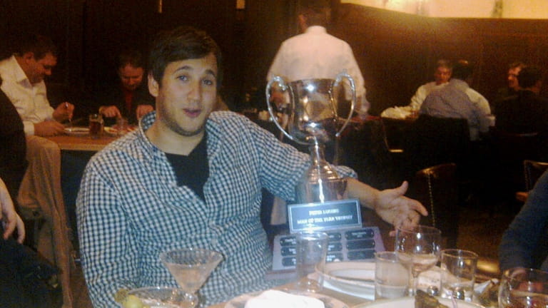 Matt Ritter holds the Man of the Year trophy at...