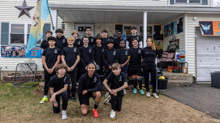 The LLA soccer club, with their coach Claudia Stinson, formed...