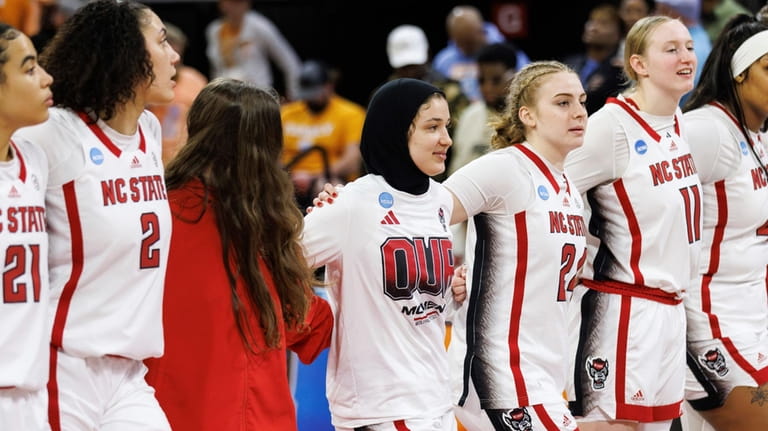 North Carolina State's Jannah Eissa, middle, celebrates with her team...