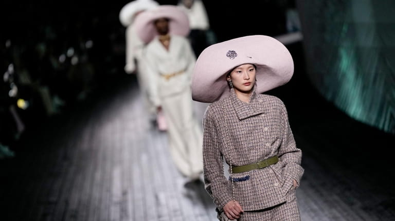 A model wears a creation as part of the Chanel...