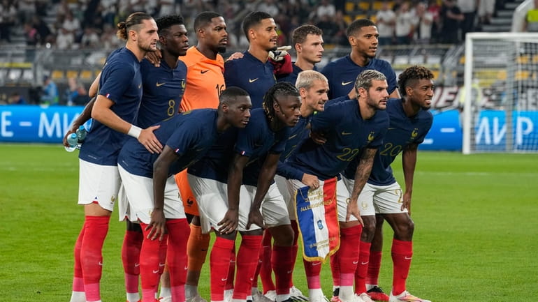 France's players pose for photographers before the international friendly soccer...
